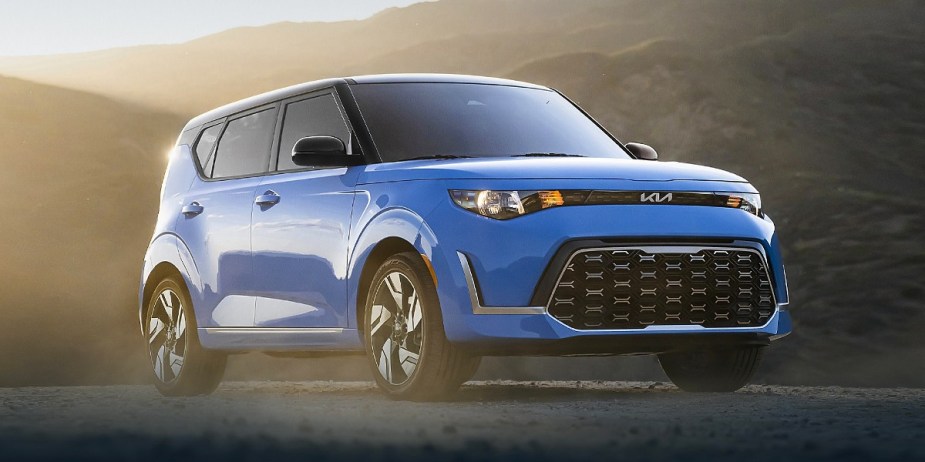 A blue 2023 Kia Soul subcompact SUV is parked. 