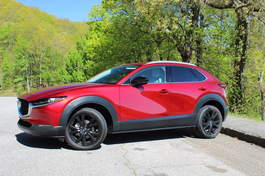 The side view of the 2023 Mazda CX-30 parked on pavement