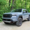 The 2023 Nissan Frontier Pro-4X off-roading on a dirt trail