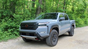 The 2023 Nissan Frontier Pro-4X off-roading on a dirt trail