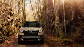 A 2023 Nissan Pathfinder driving in the woods.