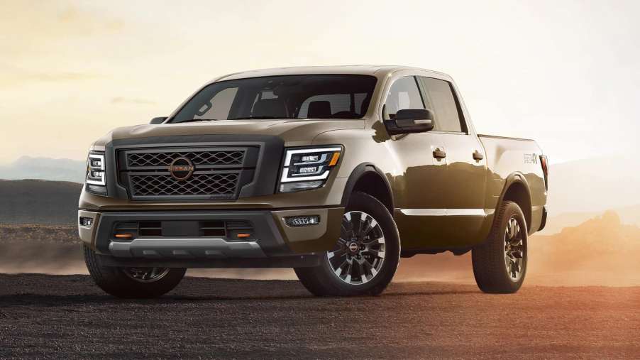 The 2023 Nissan Titan parked in sand at dusk