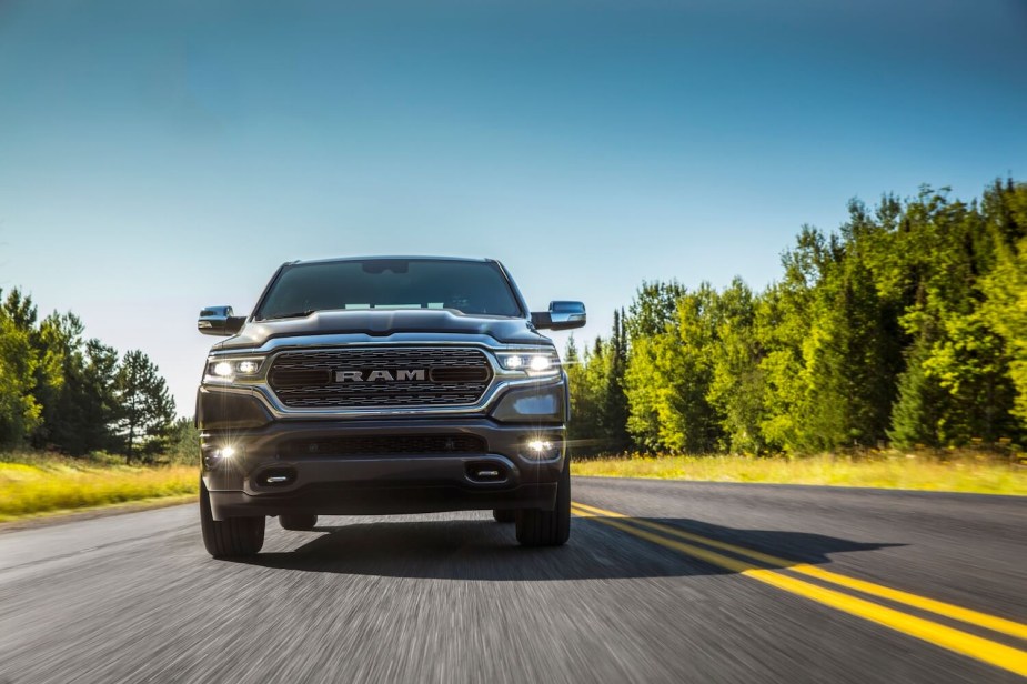 A Ram 1500 Limited driving down the road.