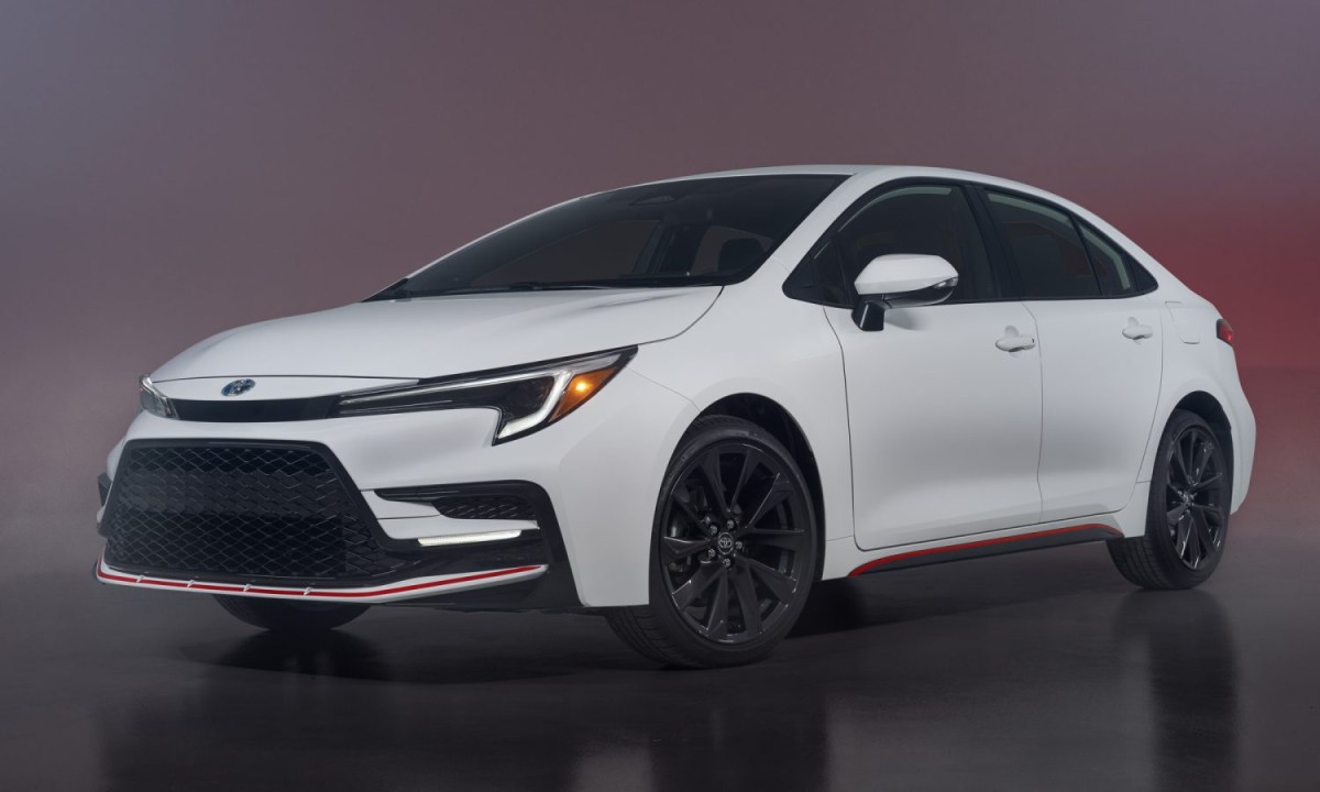 2023 Toyota Corolla Hybrid in white parked on display. The Toyota Corolla offers incredible value.