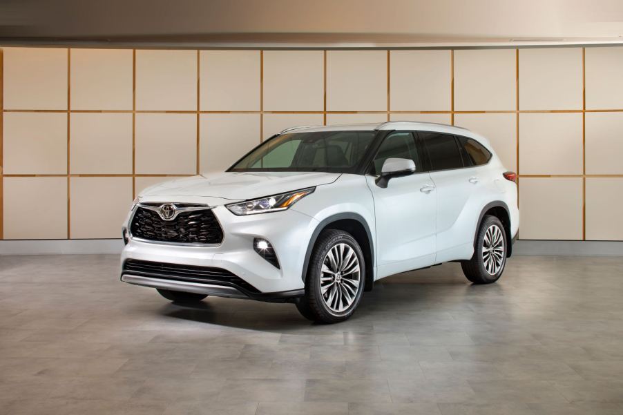 A 2023 Toyota Highlander on display in a showroom.