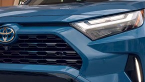 The front of a blue 2023 Toyota RAV4 Hybrid small SUV.