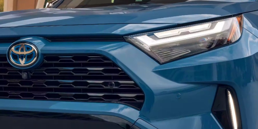 The front of a blue 2023 Toyota RAV4 Hybrid small SUV.