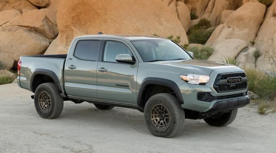 A 2023 Toyota Tacoma pickup truck driving in the mountains. This is one of the best Toyota Tacoma model years.