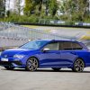 A blue 2023 Volkswagen Golf R Estate parked on a track