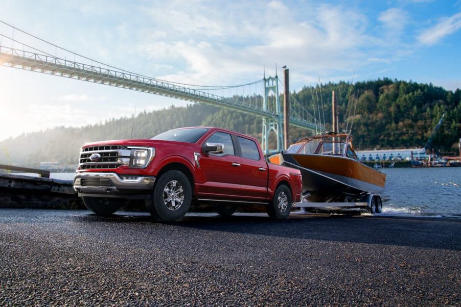 A 2023 Ford F-150 with an EcoBoost engine tows a trailer.