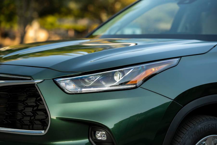 A close-up shot of the grille of a green 2023 Toyota Highlander