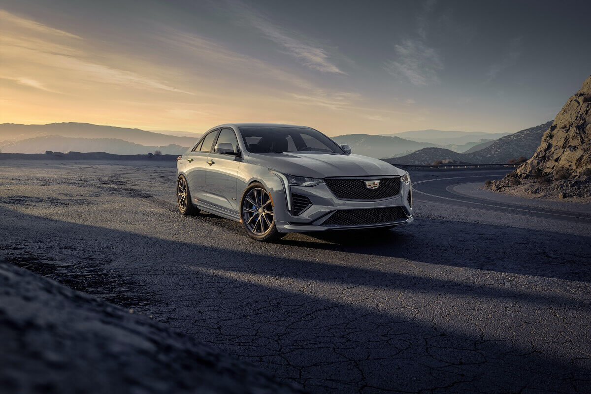 A 2023 Cadillac CT4 poses on a desert landscape.