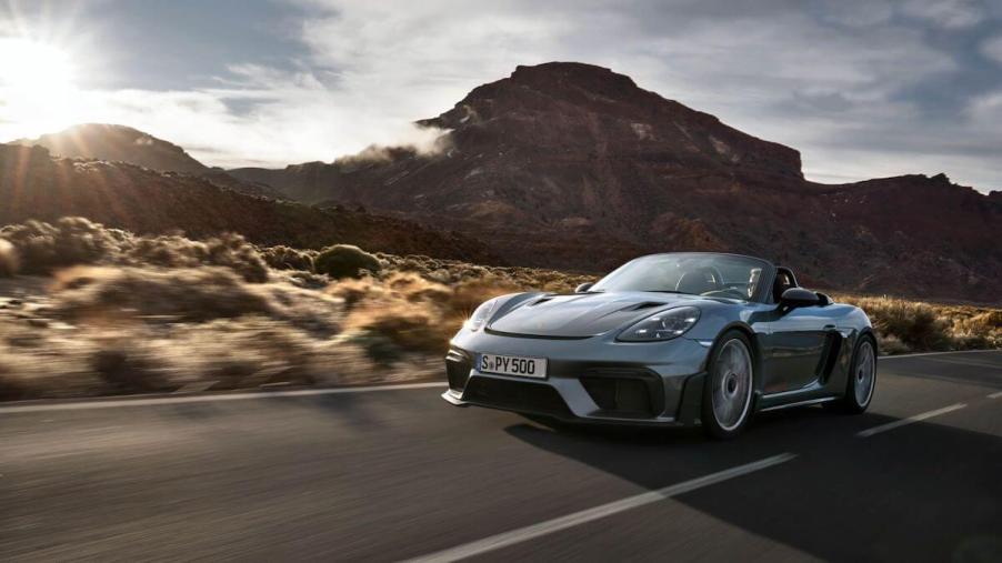 A gray 2024 Porsche 718 Spyder RS driving in the desert