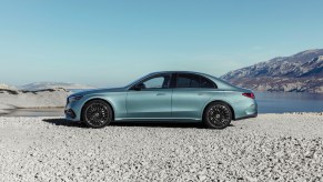 A silver-blue E450 AMG parked on a beach