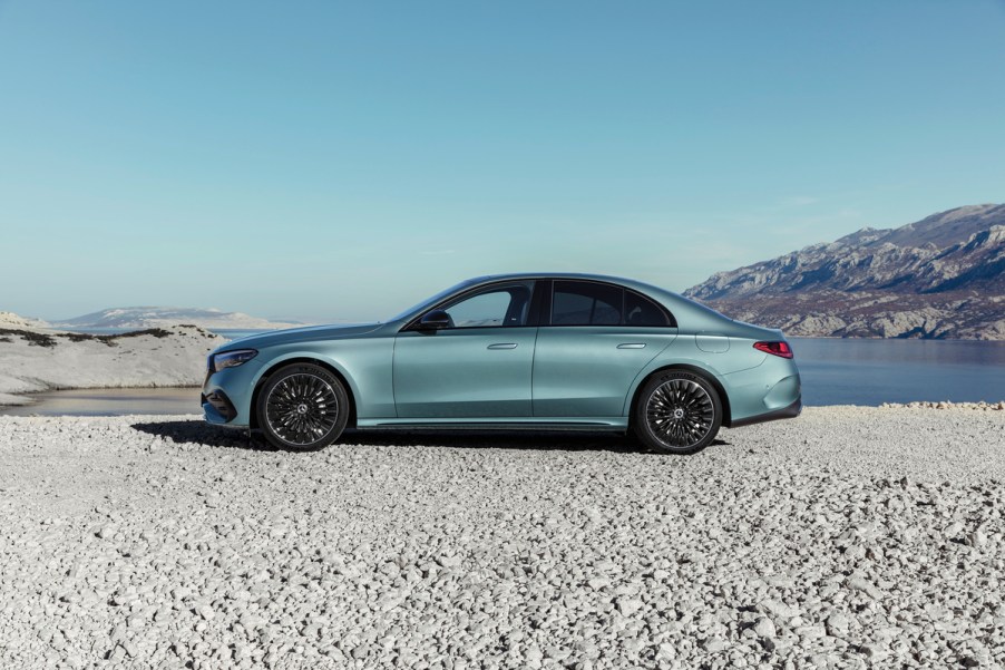 A silver-blue E450 AMG parked on a beach