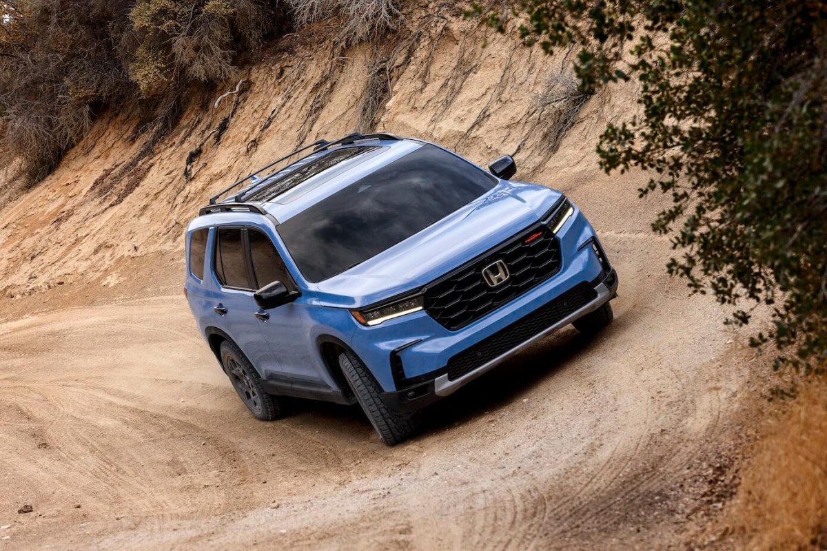 Blue 2023 Honda Pilot TrailSport driving off road in the desert