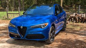 A blue 2023 Alfa Romeo Stelvio small luxury SUV is parked.