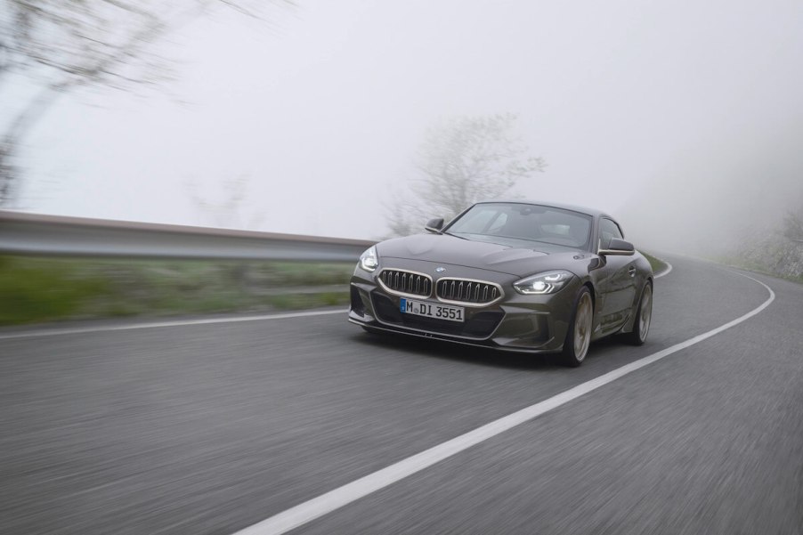 A silver BMW Shooting Brake Concept driving on a two lane road