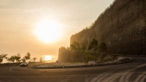 Car driving on a road in Bali, showing car crashes are the leading cause of death while traveling abroad