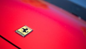 Logo of a red Ferrari car at the second edition of the Autopia Fair