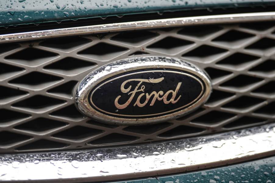 A Ford logo on the front grille of a car.