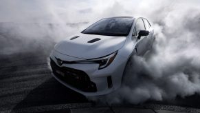 A white Toyota GR Corolla doing a burnout