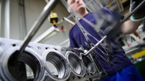 A stack of head gaskets in a machine shop