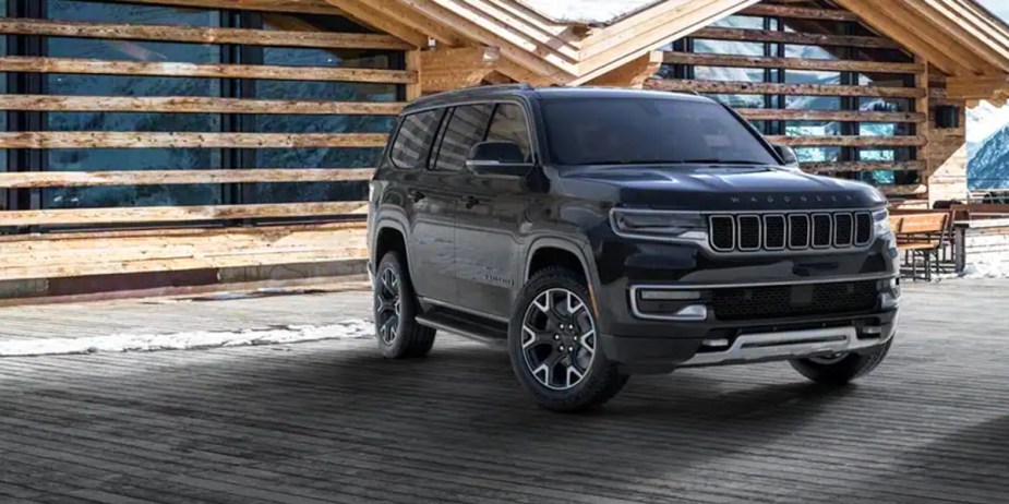 A black 2023 Jeep Wagoneer full-size SUV is parked. 