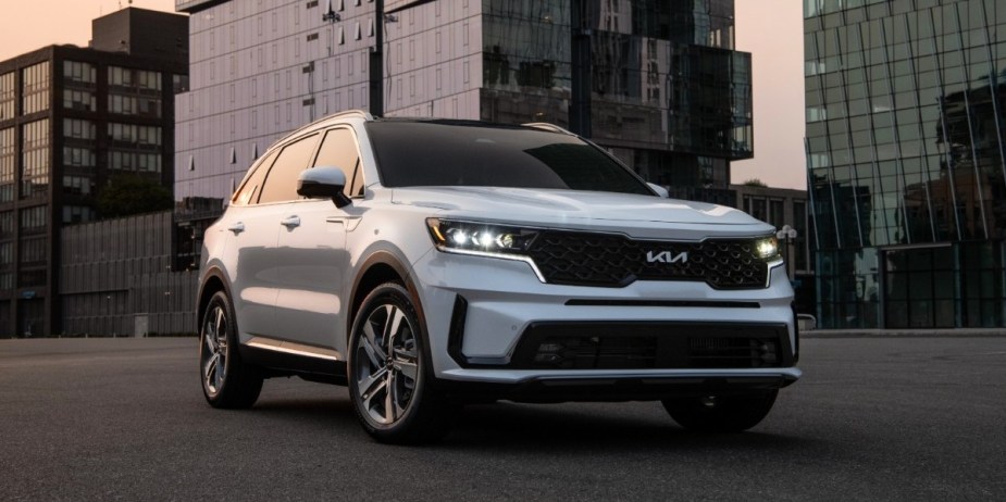 A white Kia Sorento Plug-In Hybrid midsize PHEV. 