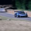 A McLaren Senna GTR driving up the hill at GoodWood festival of speed