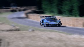 A McLaren Senna GTR driving up the hill at GoodWood festival of speed