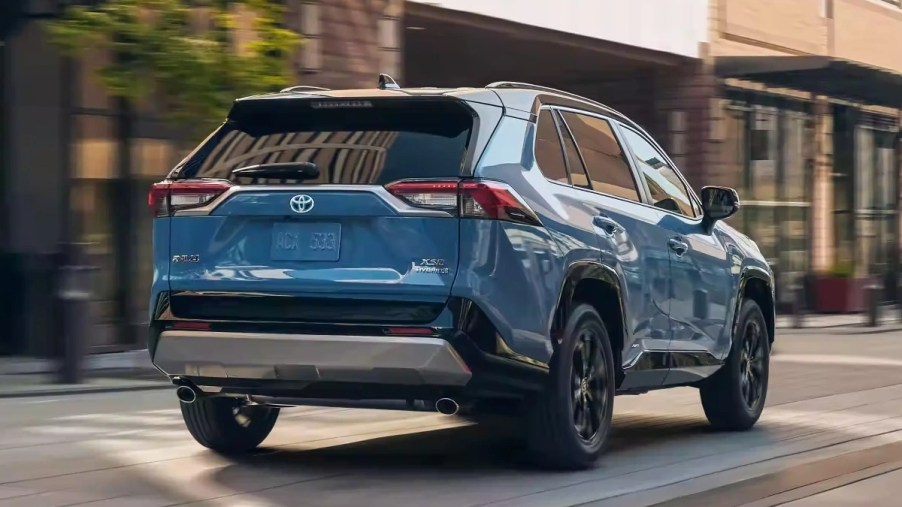 Rear angle view of blue 2023 Toyota RAV4