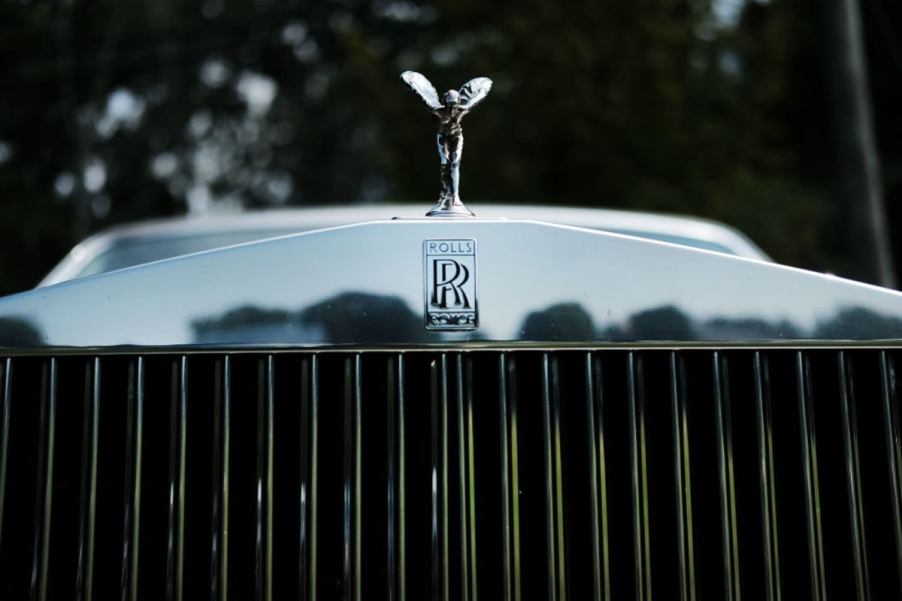 The front grille of a Rolls-Royce luxury car.