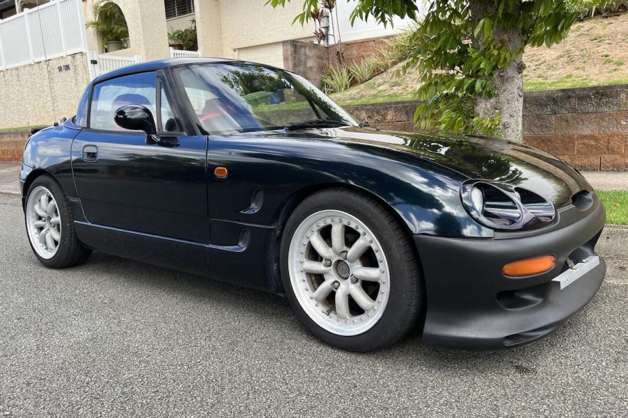 A 1994 Suzuki Cappuccino parked outdoors