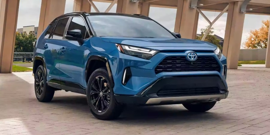 A blue 2023 Toyota RAV4 Hybrid small hybrid SUV is parked.