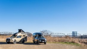 The Toyota Hilux BR75 camper conversion is on display.