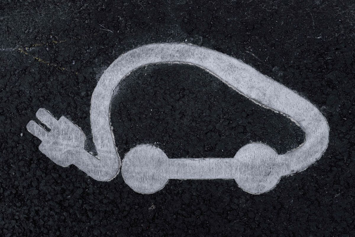 Road signage depicting an electric car visage seen in Paris, France