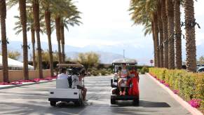 Maria Sakkari takes a golf cart to her match against Aryna Sabalenka during the BNP Paribas Open on Mar. 17, 2023