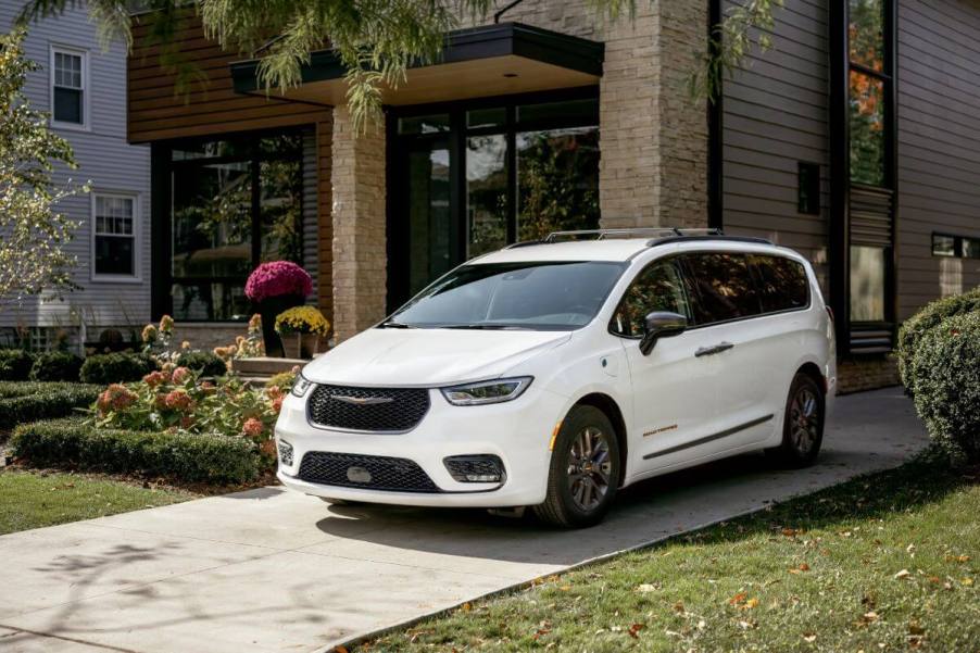 A white 2023 Chrysler Pacifica Road Tripper special edition parked on a home driveway