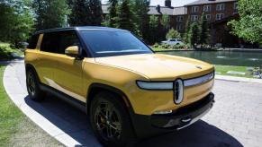 A yellow Rivian R1S full-size electric SUV model parked outside the Allen & Company Sun Valley Conference