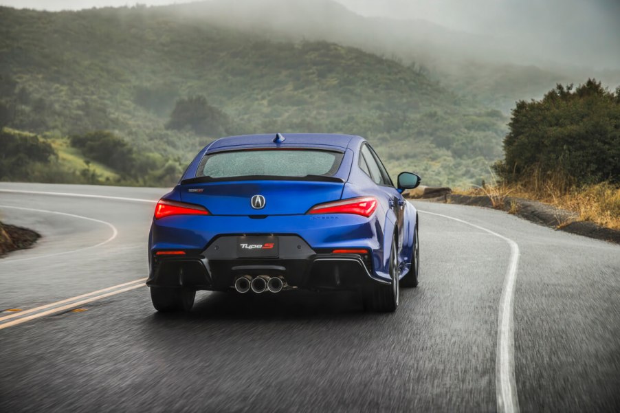 A rear view of a blue 2023 Acura Integra Type S