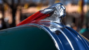 Closeup of the native american chief hood ornament on a 1948 Pontiac car.