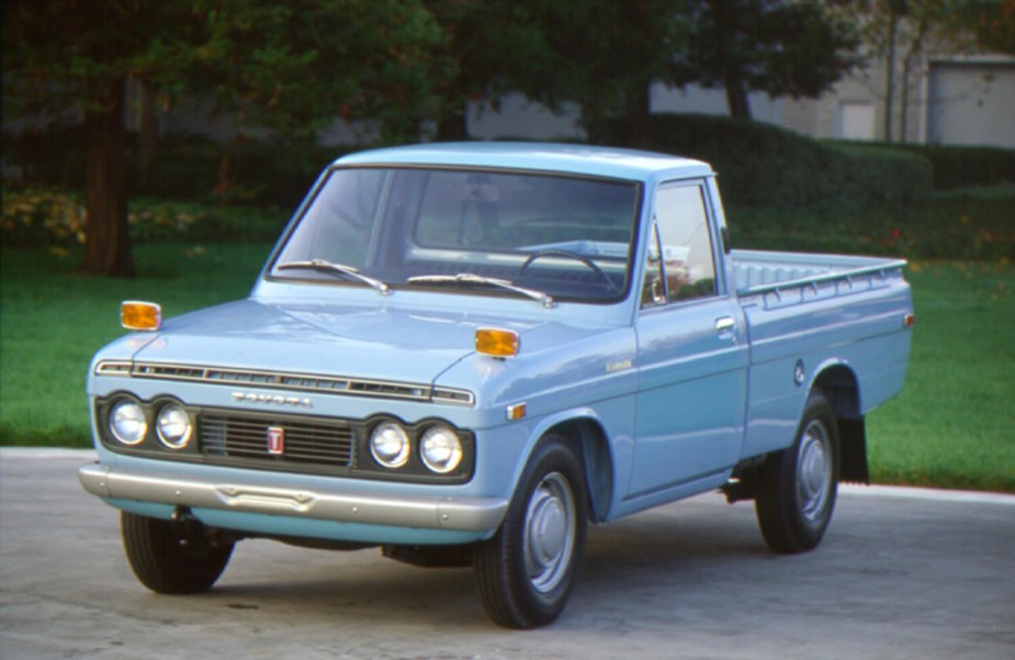 Light blue Toyota hi-lux pickup truck.