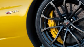 A Z06 shows off its big carbon brakes and large black wheels.