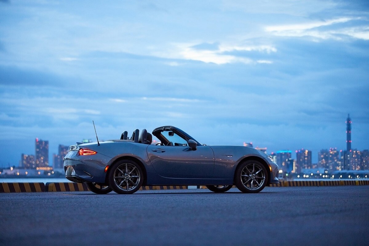 A gray Mazda MX-5 Miata can be a cheap used sports car option.