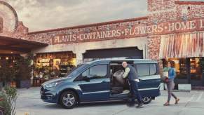 A 2021 Ford Transit Connect parked outside a garden store