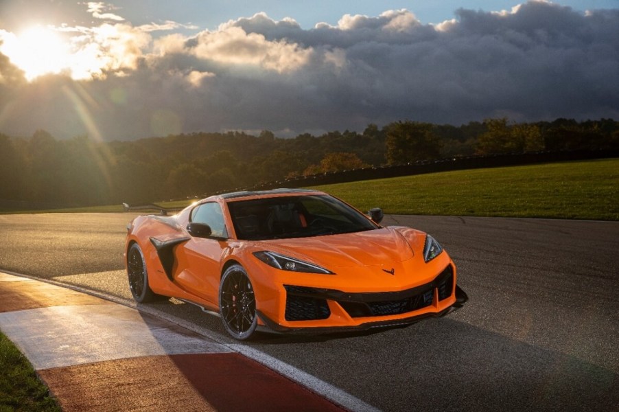 A bright orange Chevrolet Corvette Z06 shines under the sun.