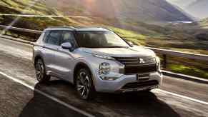 The 2023 Mitsubishi Outlander PHEV driving down the road