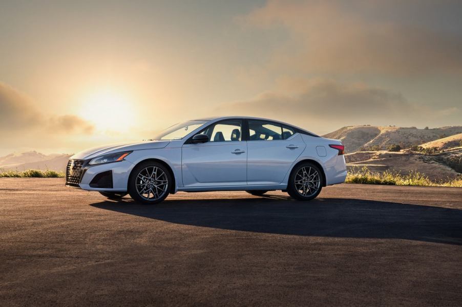 A white 2023 Nissan Altima parked at sunset.