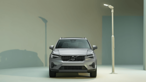 A promotional shot of a 2023 Volvo XC40 subcompact luxury SUV model illuminated by a white streetlight